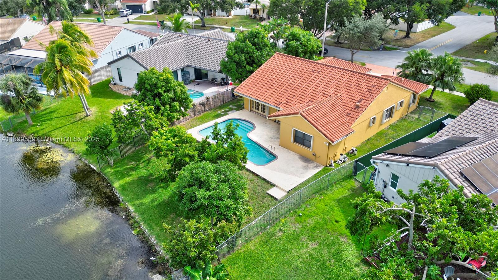 6255 Hawkes Bluff Avenue Davie, FL 33331 - Photo 7 of 51 an aerial view of a house with a garden
