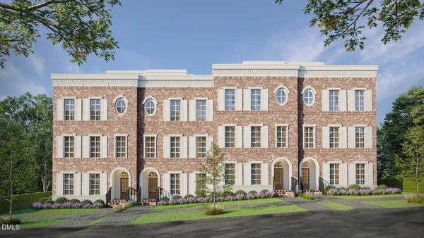 a view of a building with a yard