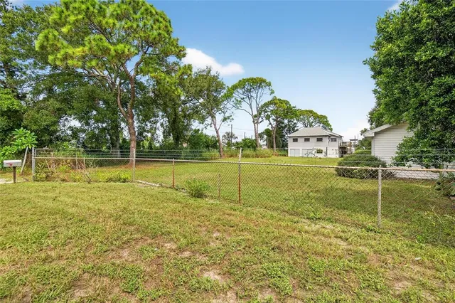 a view of a park with large trees