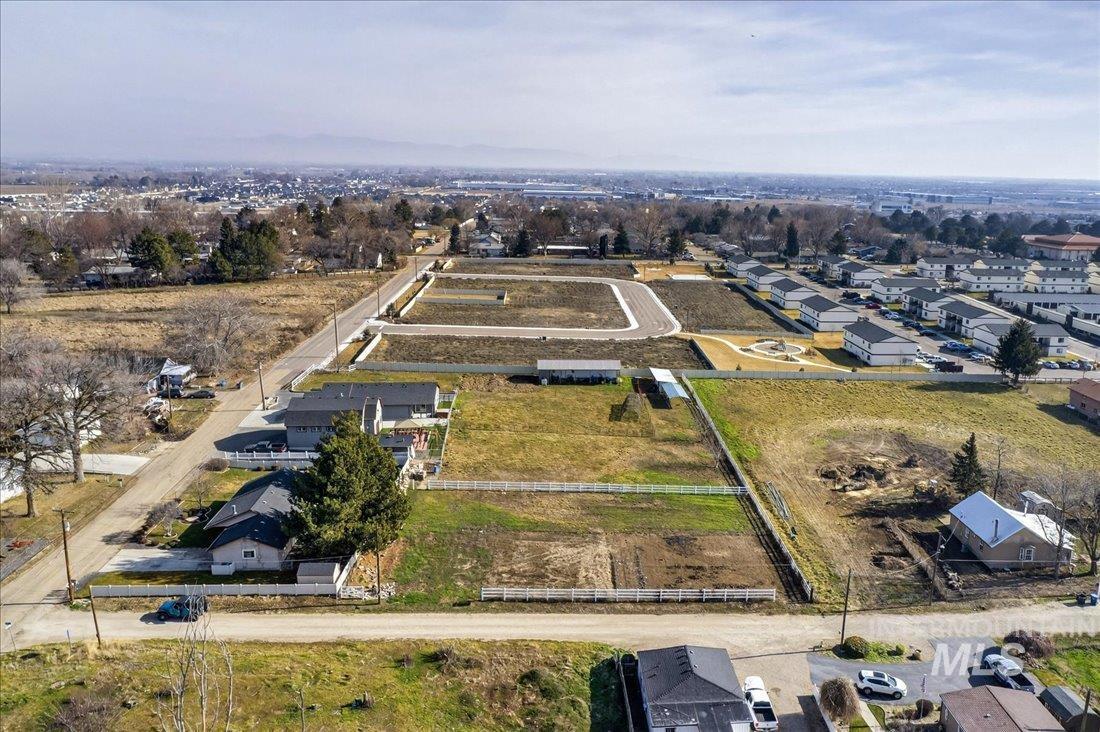 Tbd Syringa Lane Caldwell, ID 83605 - Photo 7 of 12 Aerial view of property and surrounding area with nearby suburban area