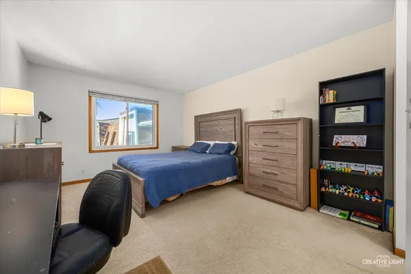 a bedroom with a bed and a cabinets
