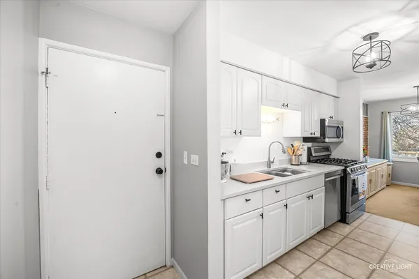 a spacious bathroom with a granite countertop sink a mirror and a