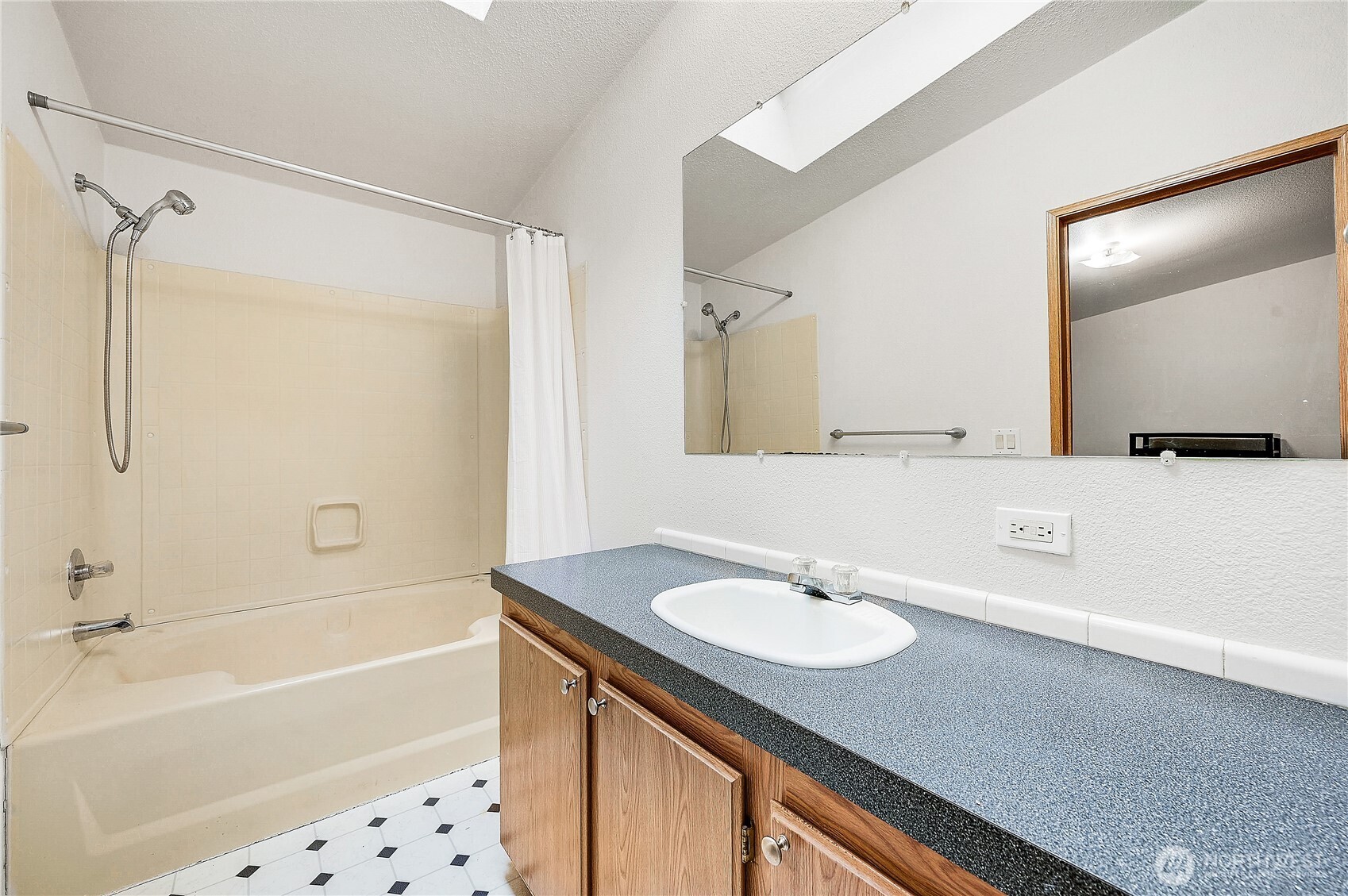 61 Flamingo Road Port Townsend, WA 98368 - Photo 16 of 22 a bathroom with a sink double vanity mirror and a bathtub