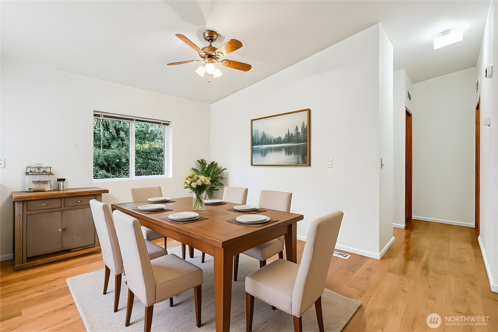 61 Flamingo Road Port Townsend, WA 98368 - Photo 5 of 22 a view of a dining room with furniture window and wooden floor
