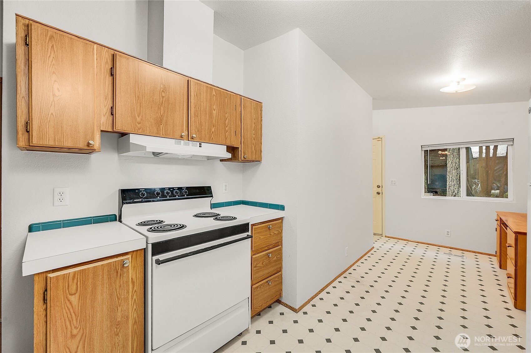 61 Flamingo Road Port Townsend, WA 98368 - Photo 9 of 22 a kitchen with stainless steel appliances a stove a sink and a refrigerator