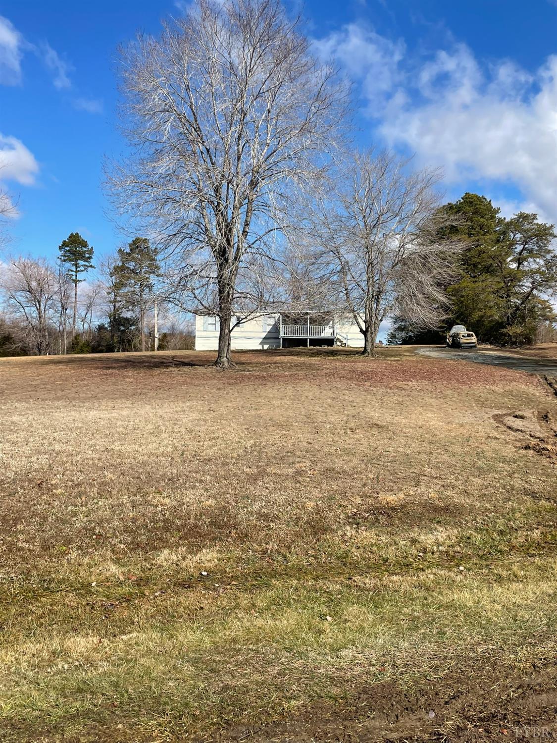 2037 Piney Grove Road Gretna, VA 24557 - Photo 17 of 18 a view of a field with trees in the background
