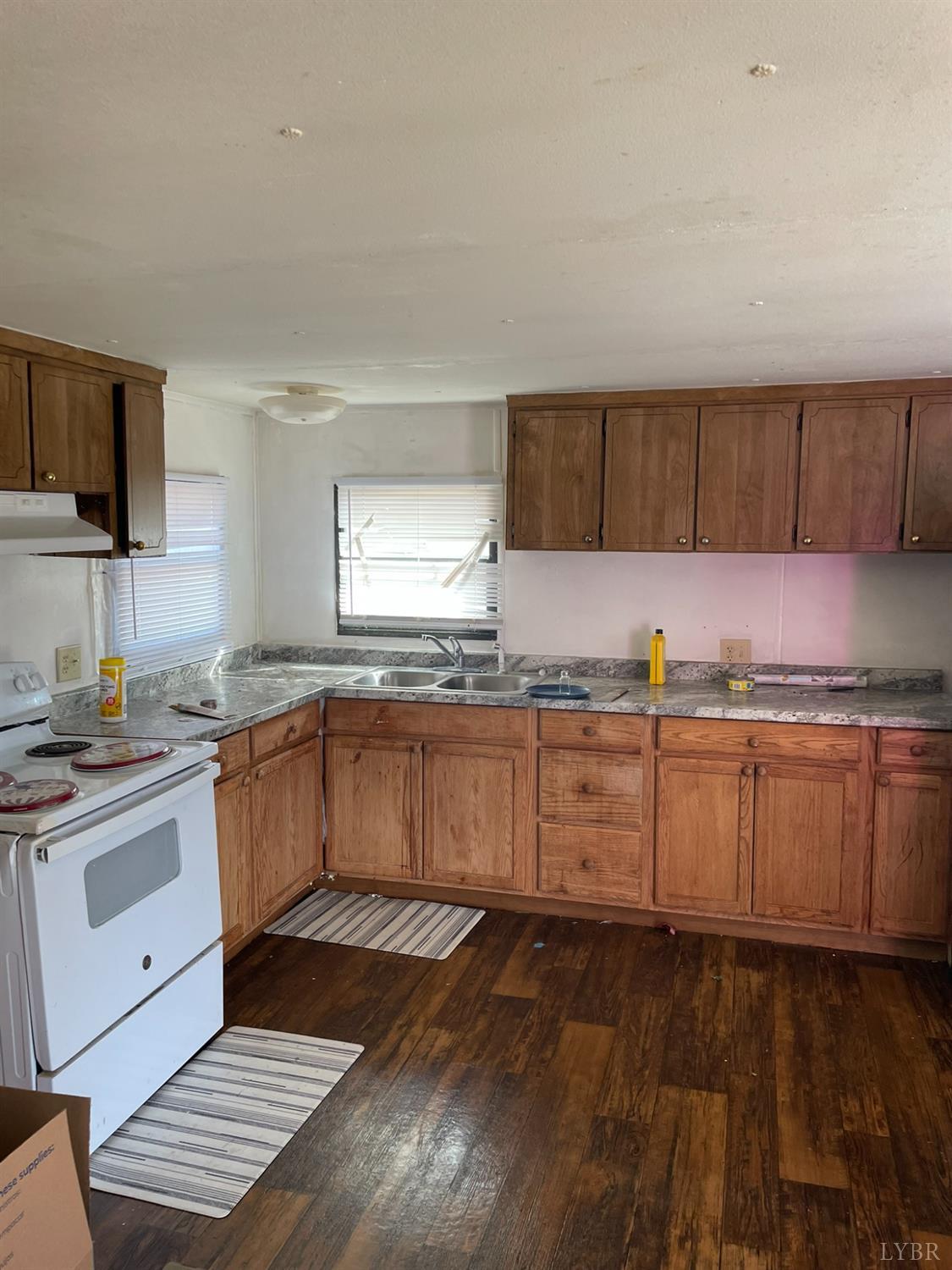2037 Piney Grove Road Gretna, VA 24557 - Photo 7 of 18 a kitchen with granite countertop a sink cabinets and stainless steel appliances