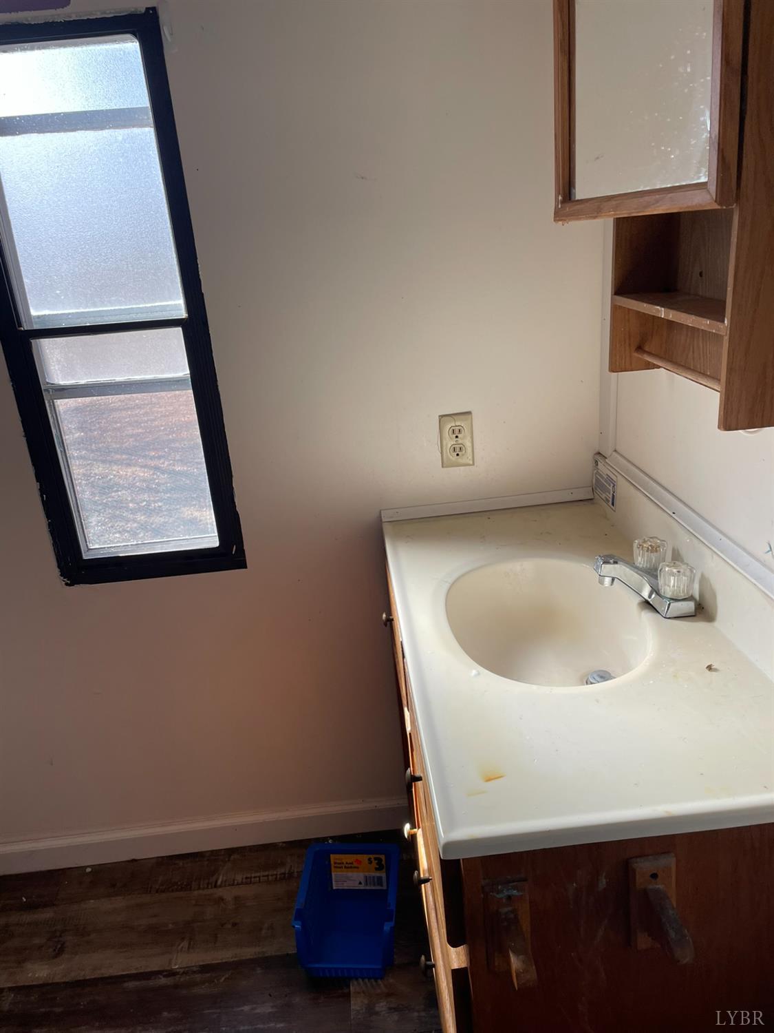 2037 Piney Grove Road Gretna, VA 24557 - Photo 8 of 18 a bathroom with a sink and a mirror