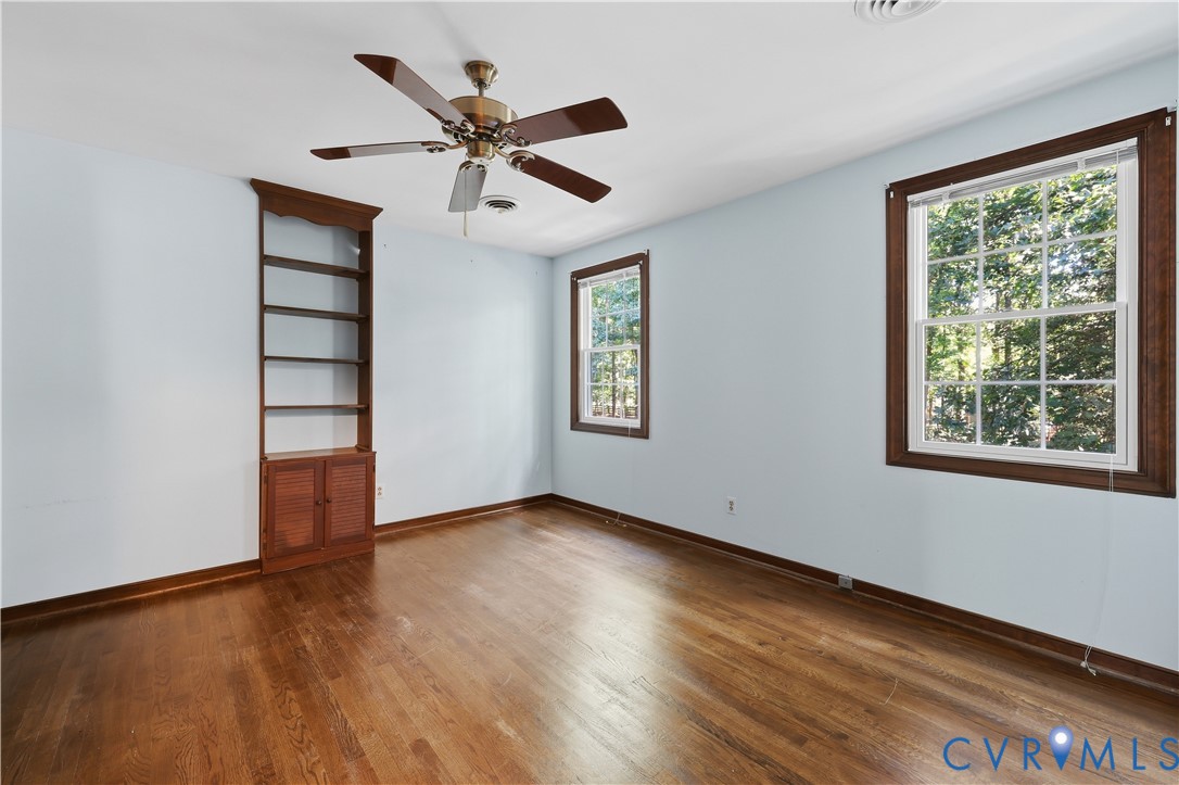 2725 Queenswood Road Midlothian, VA 23113 - Photo 16 of 17 Hardwood flooring, large closet, ceiling fan, and