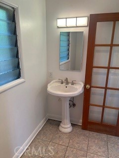 167 North Center Street Redlands, CA 92373 - Photo 13 of 19 a bathroom with a sink and mirror