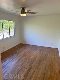 167 North Center Street Redlands, CA 92373 - Photo 17 of 19 an empty room with wooden floor fan and windows