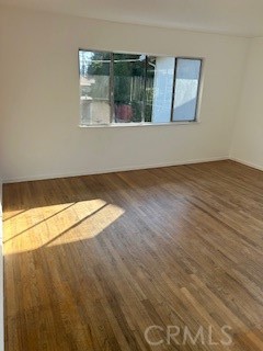 167 North Center Street Redlands, CA 92373 - Photo 4 of 19 a view of an empty room with wooden floor and a window