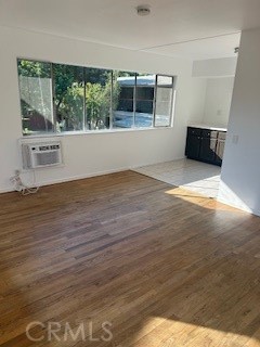 167 North Center Street Redlands, CA 92373 - Photo 5 of 19 an empty room with wooden floor and windows