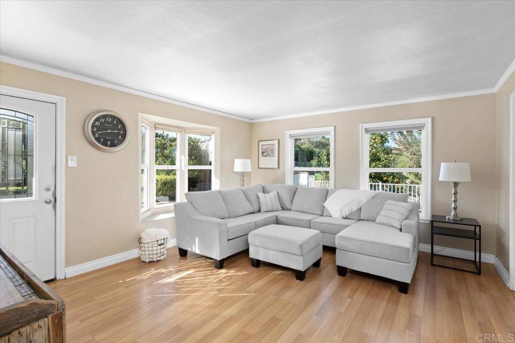 697 Ocean View Avenue Encinitas, CA 92024 - Photo 12 of 41 a living room with furniture and a large window