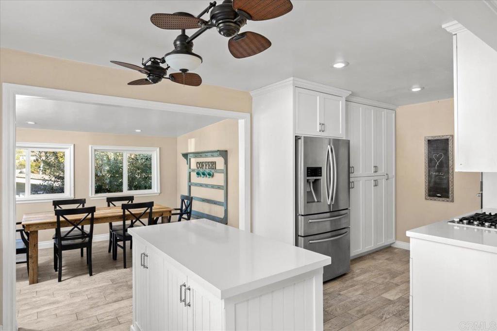 697 Ocean View Avenue Encinitas, CA 92024 - Photo 17 of 41 a large kitchen with kitchen island a large counter top space appliances and living room