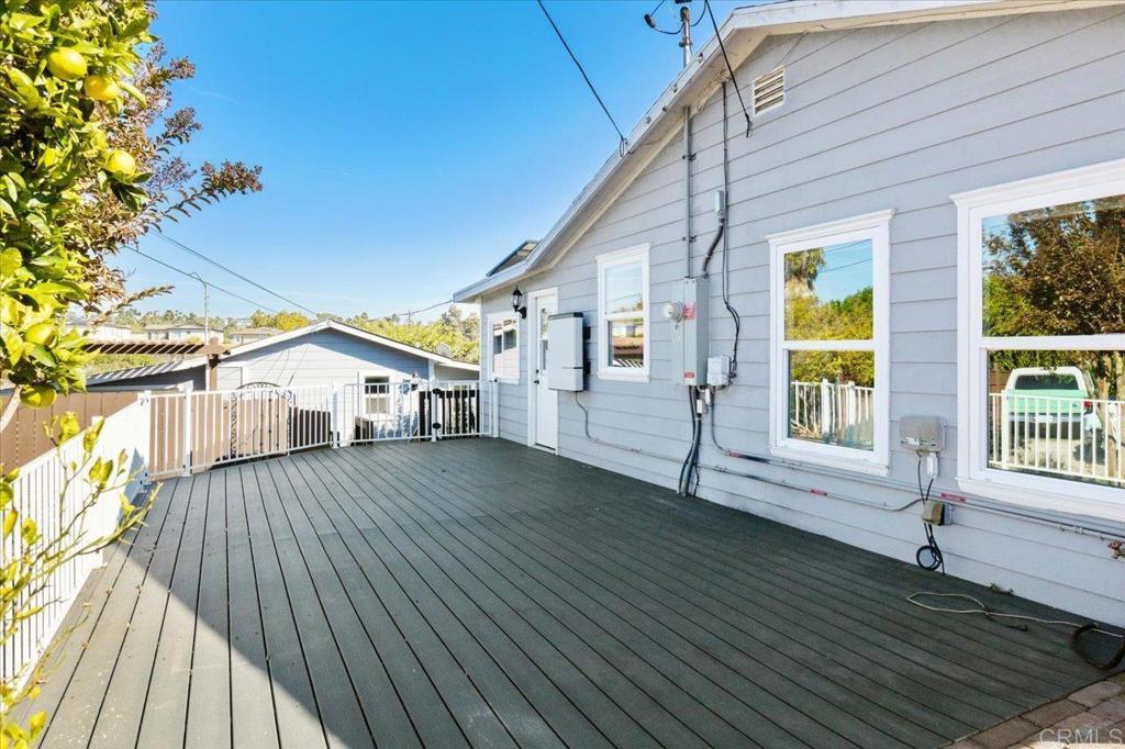 697 Ocean View Avenue Encinitas, CA 92024 - Photo 20 of 41 a view of house with deck outdoor seating and wooden floor