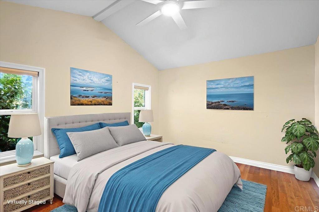 697 Ocean View Avenue Encinitas, CA 92024 - Photo 24 of 41 a bedroom with bed and wooden floor