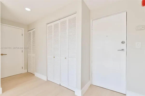 an aerial view of residential house with outdoor space and trees all around