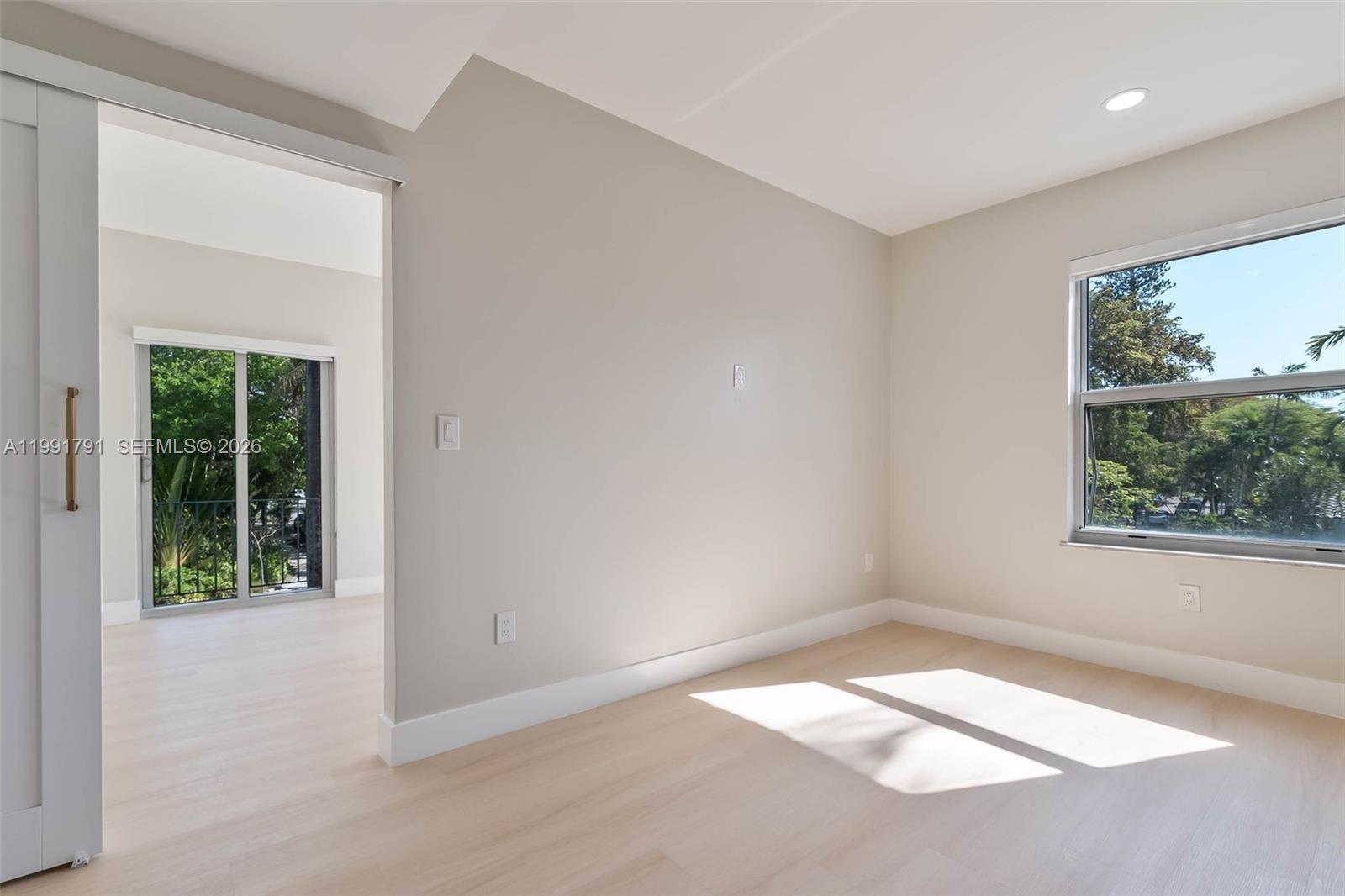 694 Northeast 76th Street, Unit 6 Miami, FL 33138 - Photo 13 of 35 an empty room with a window