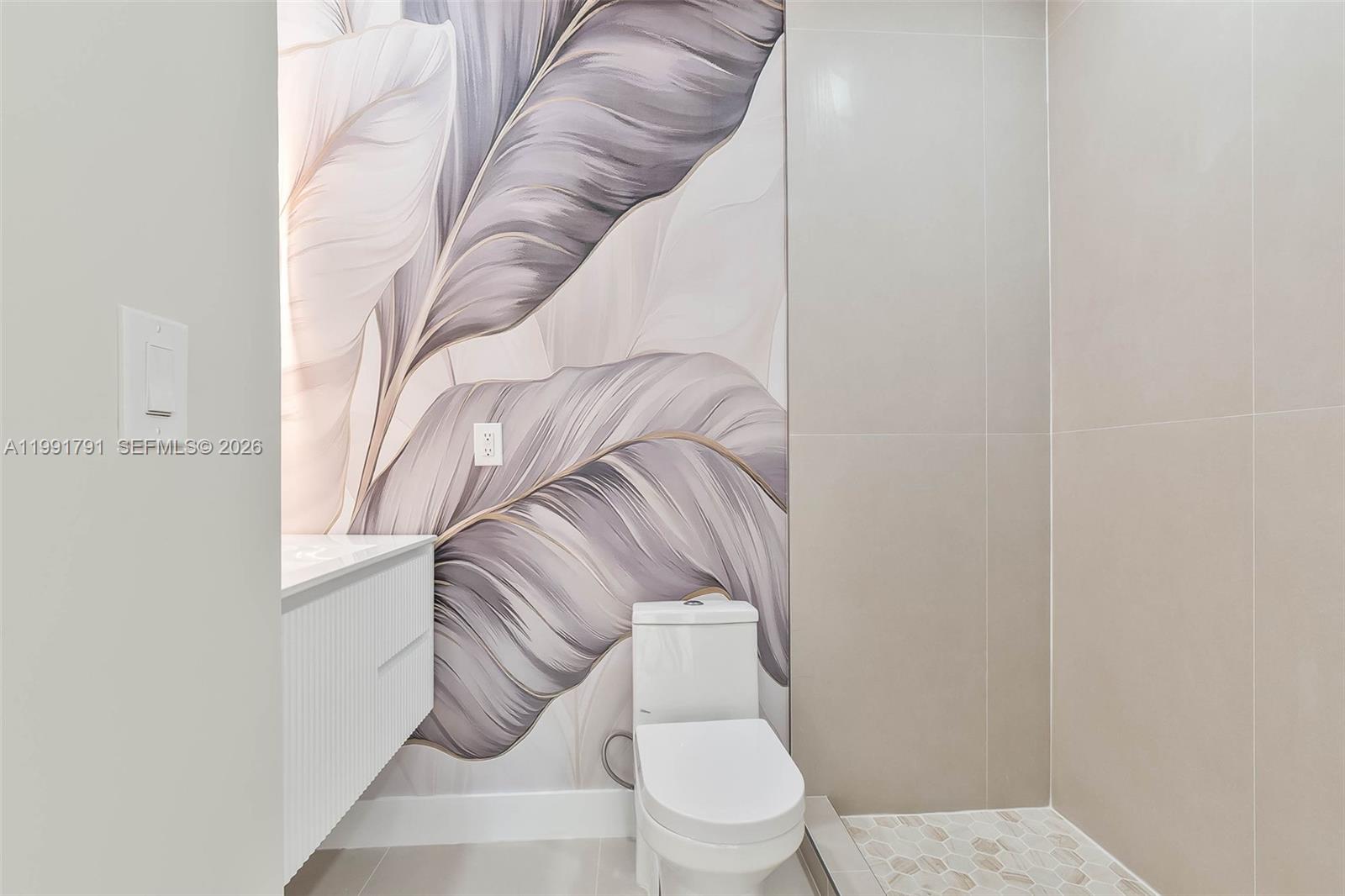 694 Northeast 76th Street, Unit 6 Miami, FL 33138 - Photo 18 of 35 a bathroom with a toilet and a shower curtain
