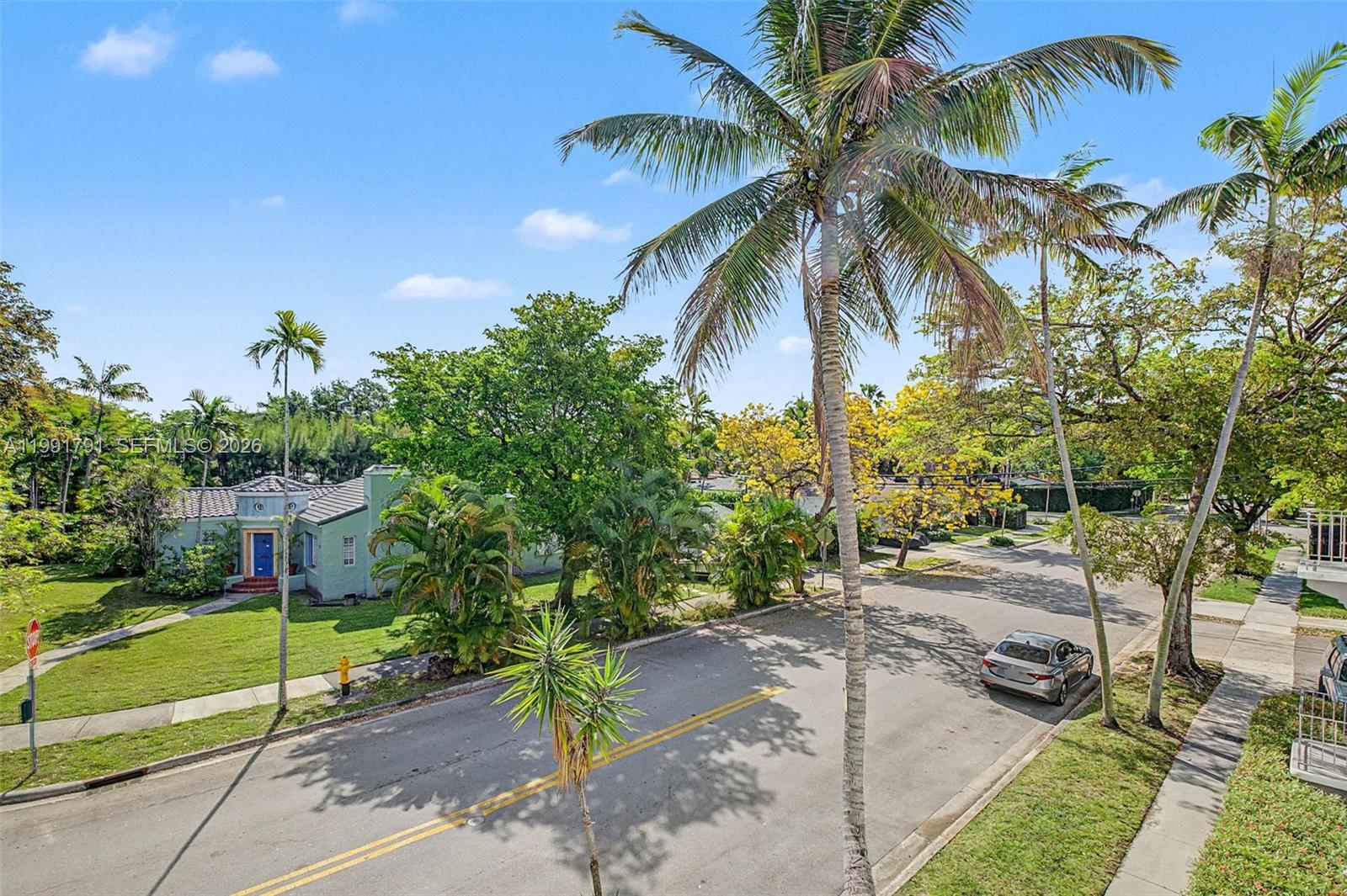 694 Northeast 76th Street, Unit 6 Miami, FL 33138 - Photo 28 of 35 a view of a street with a building in the background