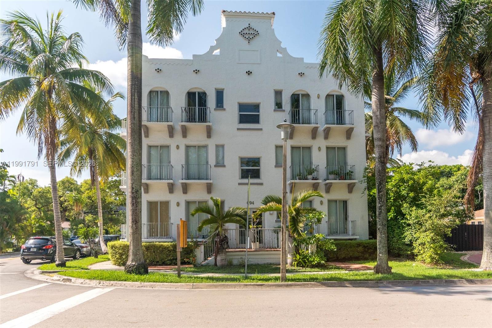 694 Northeast 76th Street, Unit 6 Miami, FL 33138 - Photo 31 of 35 a front view of multiple houses with yard