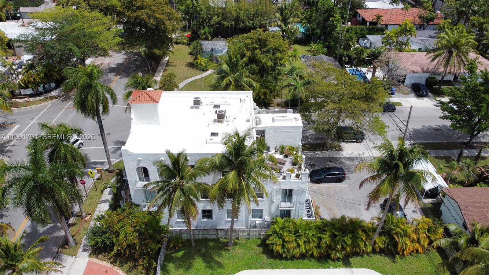 694 Northeast 76th Street, Unit 6 Miami, FL 33138 - Photo 33 of 35 an aerial view of residential house with outdoor space and trees all around
