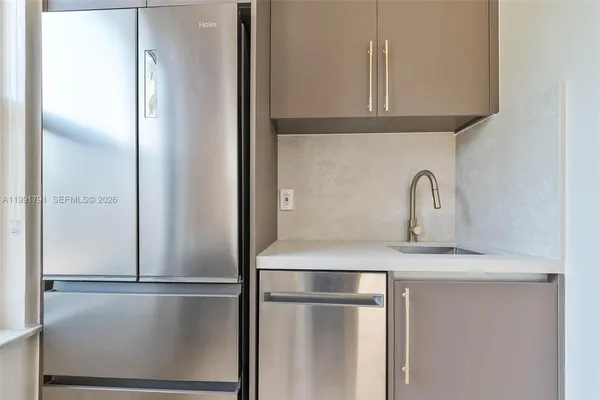 a view of empty room with window and wooden floor