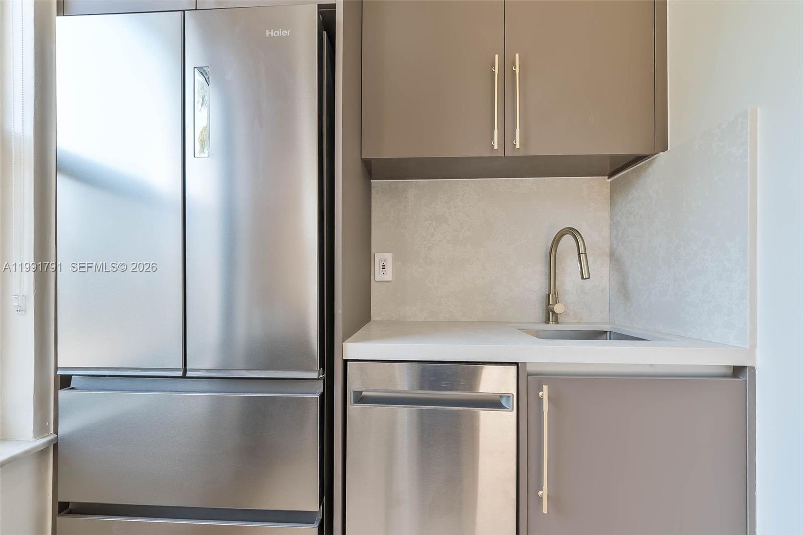 694 Northeast 76th Street, Unit 6 Miami, FL 33138 - Photo 8 of 35 a close view of a refrigerator in kitchen