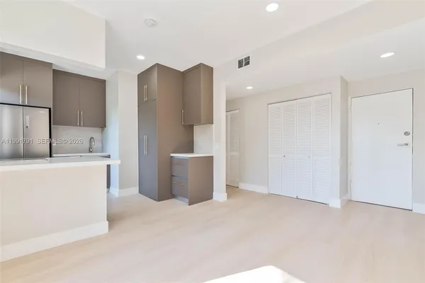 a front view of multiple houses with yard