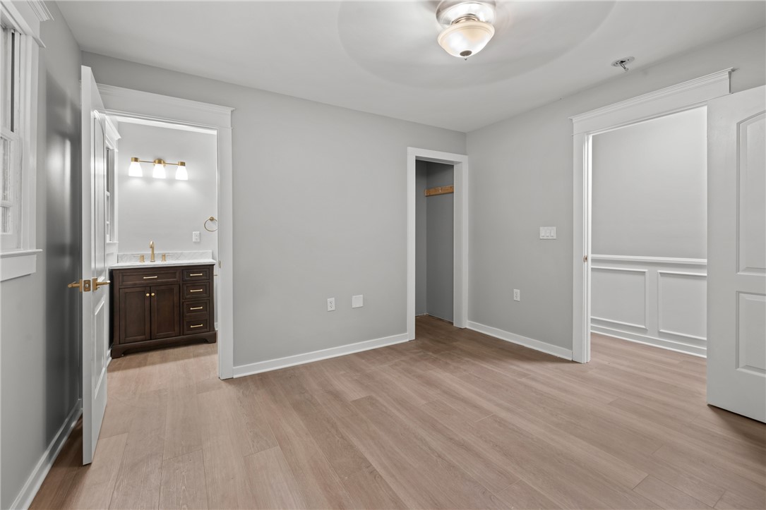 309 Woodland Way Clemson, SC 29631 - Photo 25 of 43 This bright space features sleek flooring and convenient access to a modern bathroom vanity.