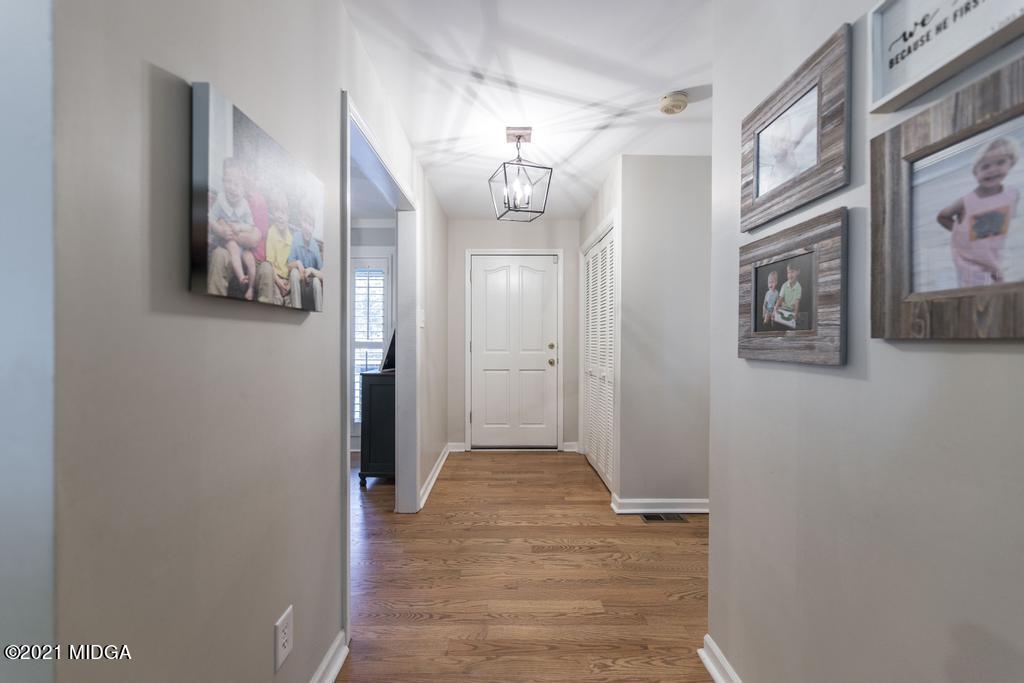 7085 Colaparchee Road Macon, GA 31220 - Photo 12 of 57 a view of a hallway with wooden floor