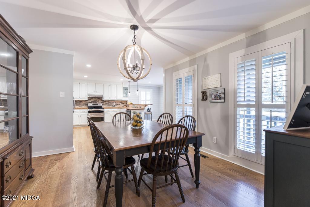 7085 Colaparchee Road Macon, GA 31220 - Photo 13 of 57 a view of a dining room with furniture window and wooden floor