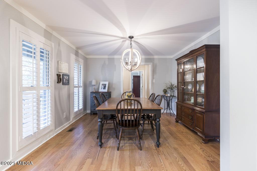 7085 Colaparchee Road Macon, GA 31220 - Photo 14 of 57 a view of a dining room with furniture window and wooden floor