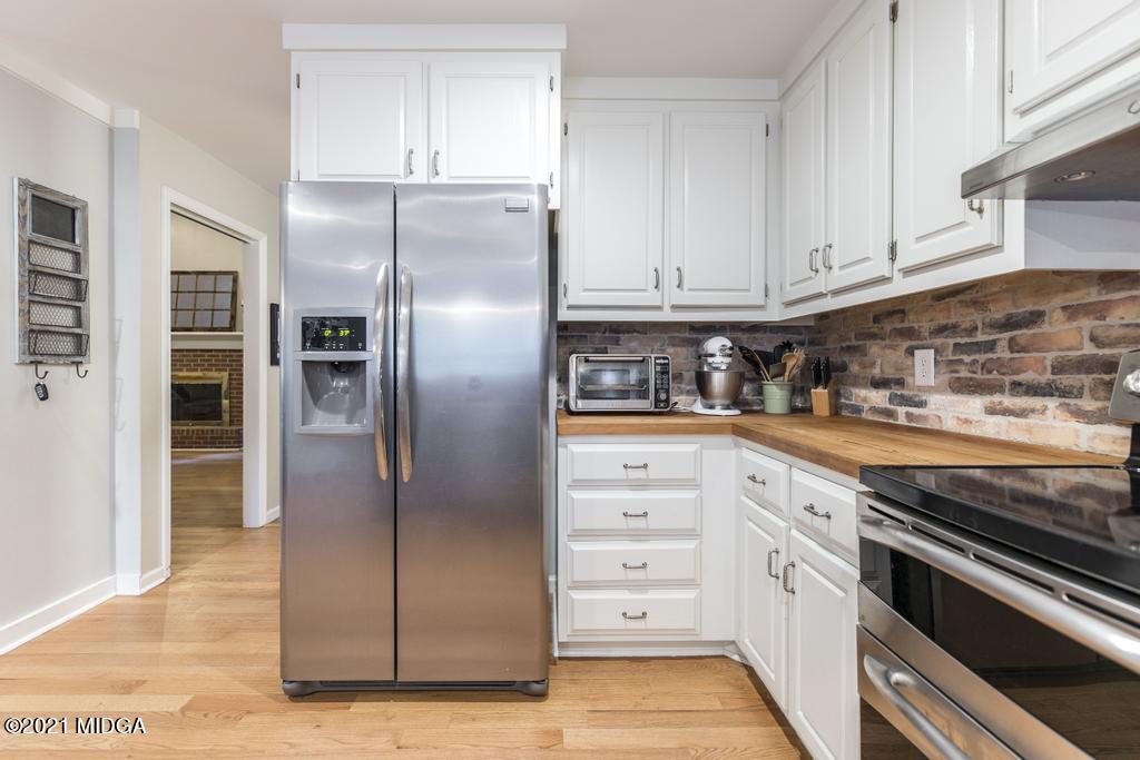 7085 Colaparchee Road Macon, GA 31220 - Photo 20 of 57 a kitchen with stainless steel appliances cabinets and a counter top space
