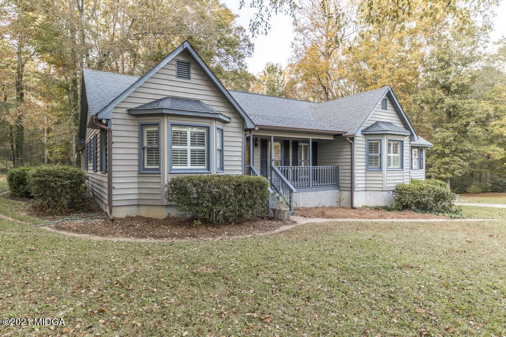 7085 Colaparchee Road Macon, GA 31220 - Photo 2 of 57 a front view of a house with a yard