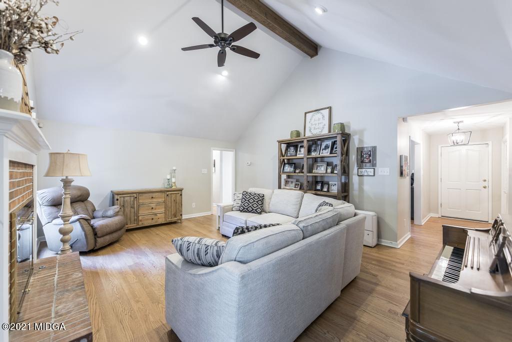 7085 Colaparchee Road Macon, GA 31220 - Photo 26 of 57 a living room with furniture and a wooden floor