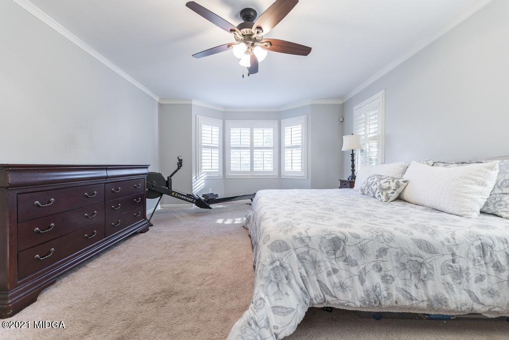 7085 Colaparchee Road Macon, GA 31220 - Photo 29 of 57 a spacious bedroom with a bed and window