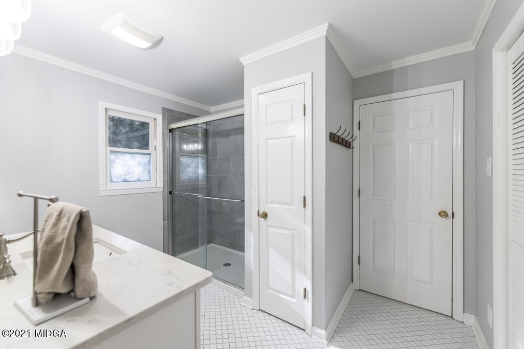 7085 Colaparchee Road Macon, GA 31220 - Photo 30 of 57 a bathroom with a sink and mirror