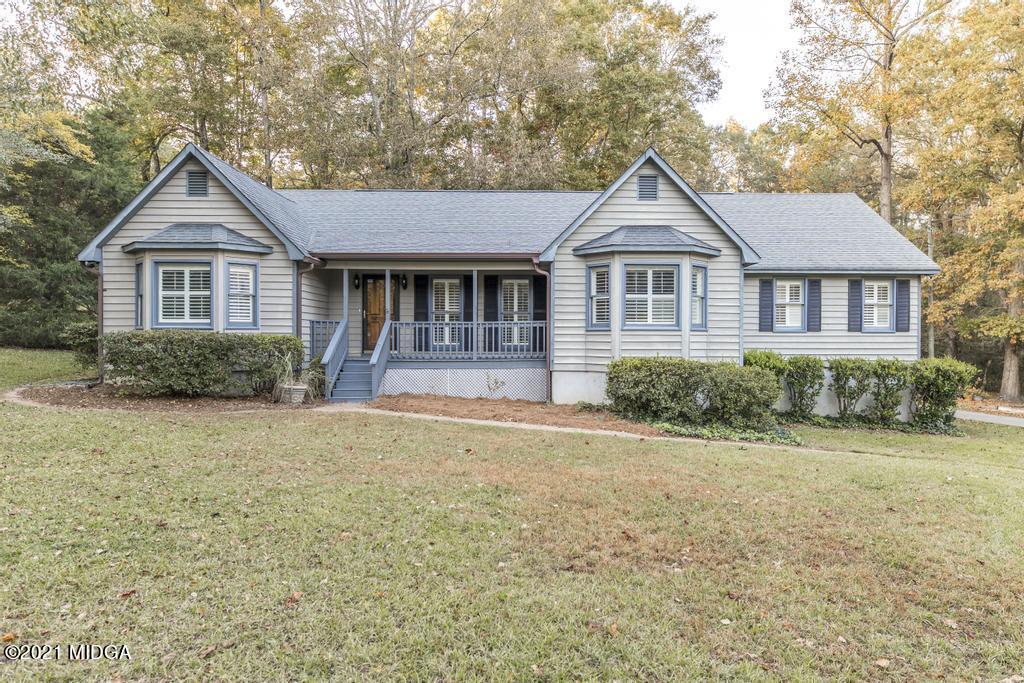 7085 Colaparchee Road Macon, GA 31220 - Photo 3 of 57 a front view of a house with a yard and garage