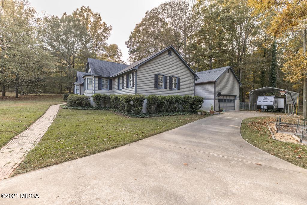 7085 Colaparchee Road Macon, GA 31220 - Photo 5 of 57 a front view of a house with a yard