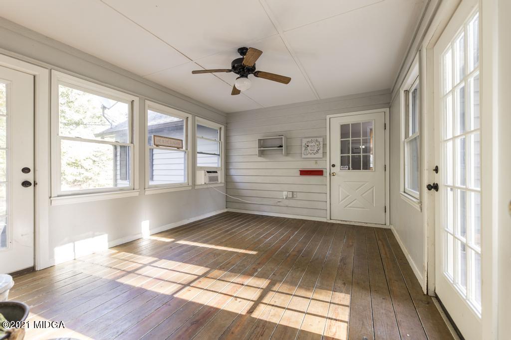 7085 Colaparchee Road Macon, GA 31220 - Photo 45 of 57 a view of an empty room with a window and wooden floor