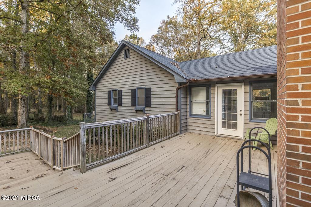 7085 Colaparchee Road Macon, GA 31220 - Photo 48 of 57 a view of a wooden deck and a backyard