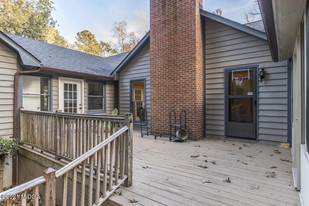 7085 Colaparchee Road Macon, GA 31220 - Photo 49 of 57 a view of a house with wooden deck