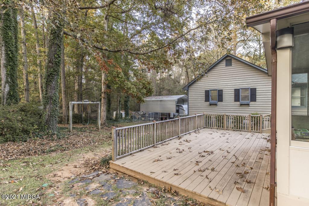 7085 Colaparchee Road Macon, GA 31220 - Photo 52 of 57 a view of a house with a wooden deck