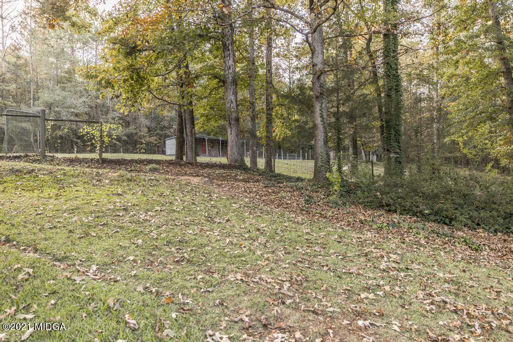7085 Colaparchee Road Macon, GA 31220 - Photo 54 of 57 a view of a yard with trees in the background