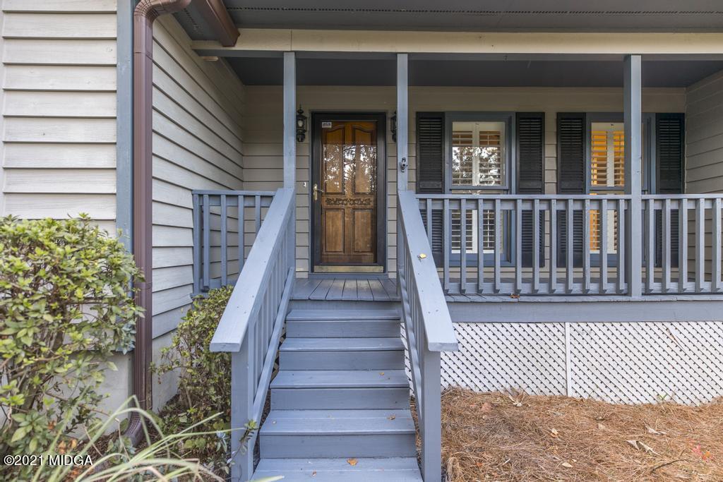 7085 Colaparchee Road Macon, GA 31220 - Photo 10 of 57 a view of a brick house with wooden floor and fence