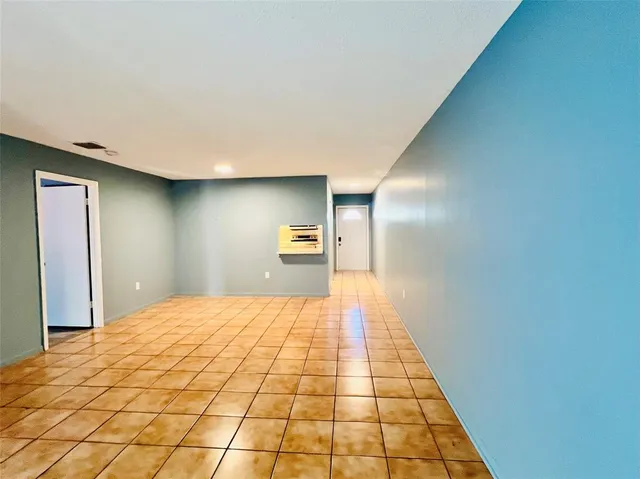 a view of an empty room and window