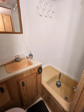 a bathroom with a sink and a washing machine