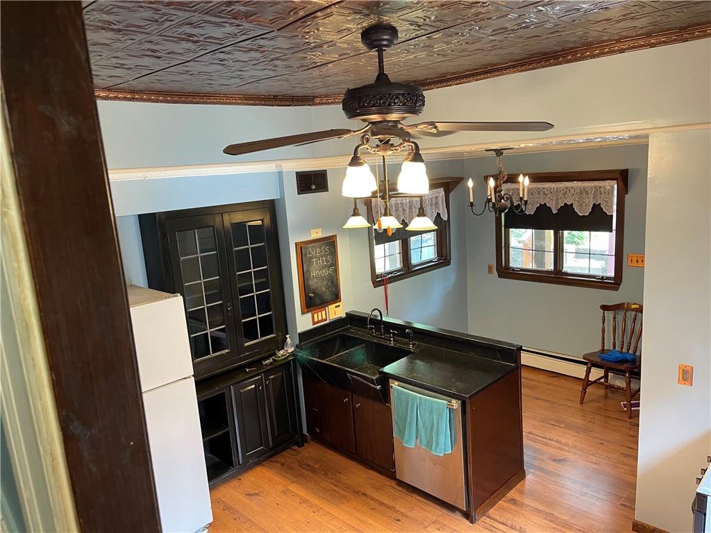 244 West Pearl Street Butler, PA 16001 - Photo 12 of 25 a kitchen with stainless steel appliances granite countertop a stove and a refrigerator
